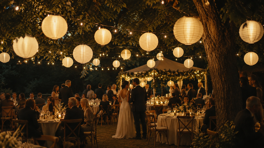 20-inch Antique White lanterns hang from festoon lights at an outdoor wedding reception