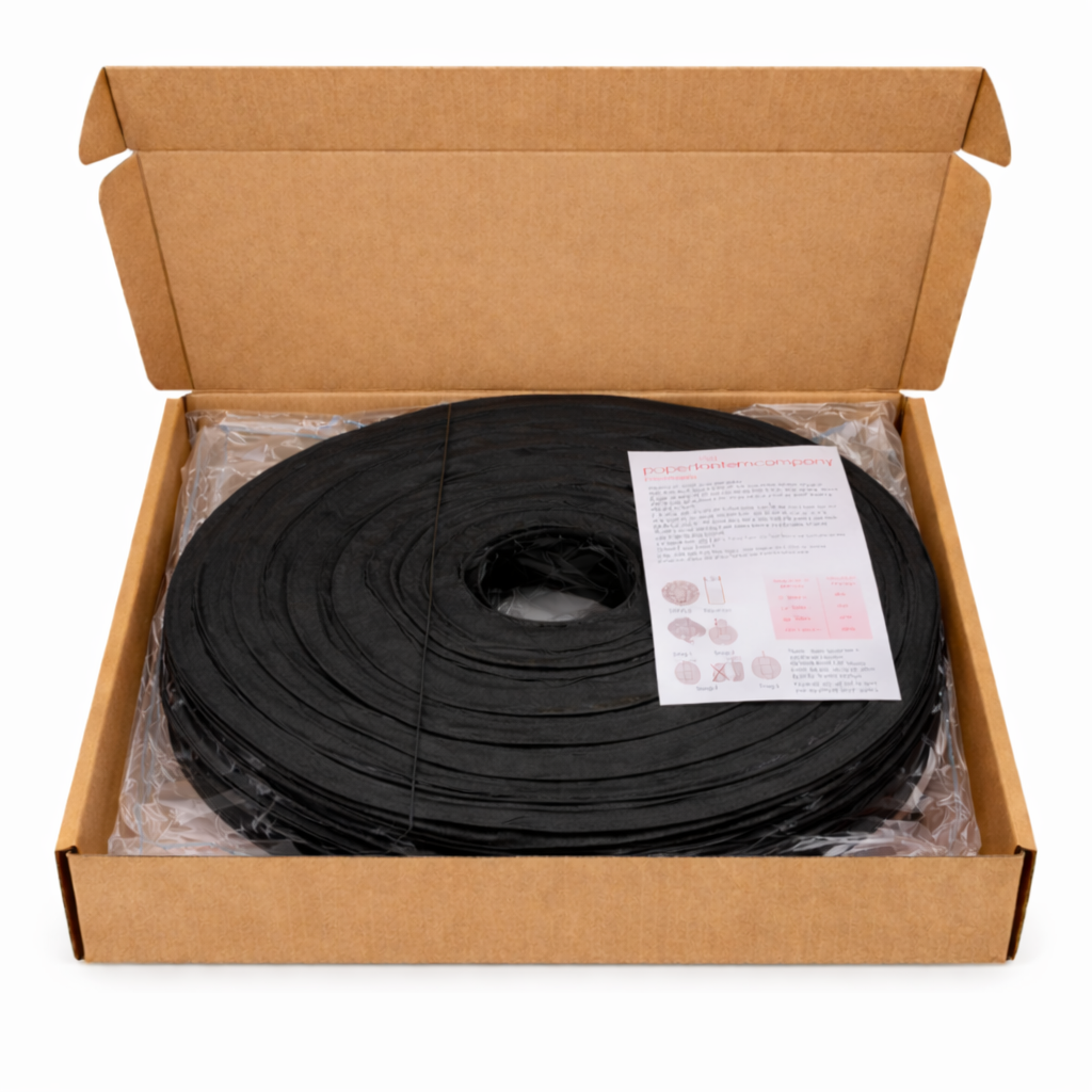 Black paper lanterns in a shipping box