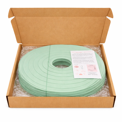 Sage green soft paper lanterns in shipping box
