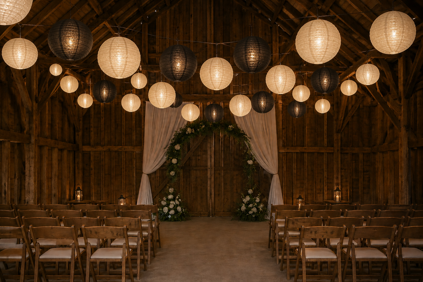 12 inch black and ivory lanterns hang for a wedding ceremony in a barn 