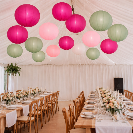 sage green, fuchsia and pink lanterns in a marquee