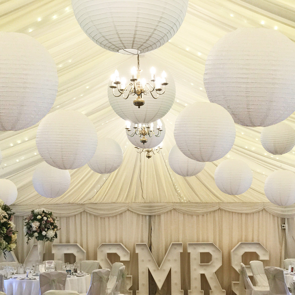 Hanging paper lanterns in pure white